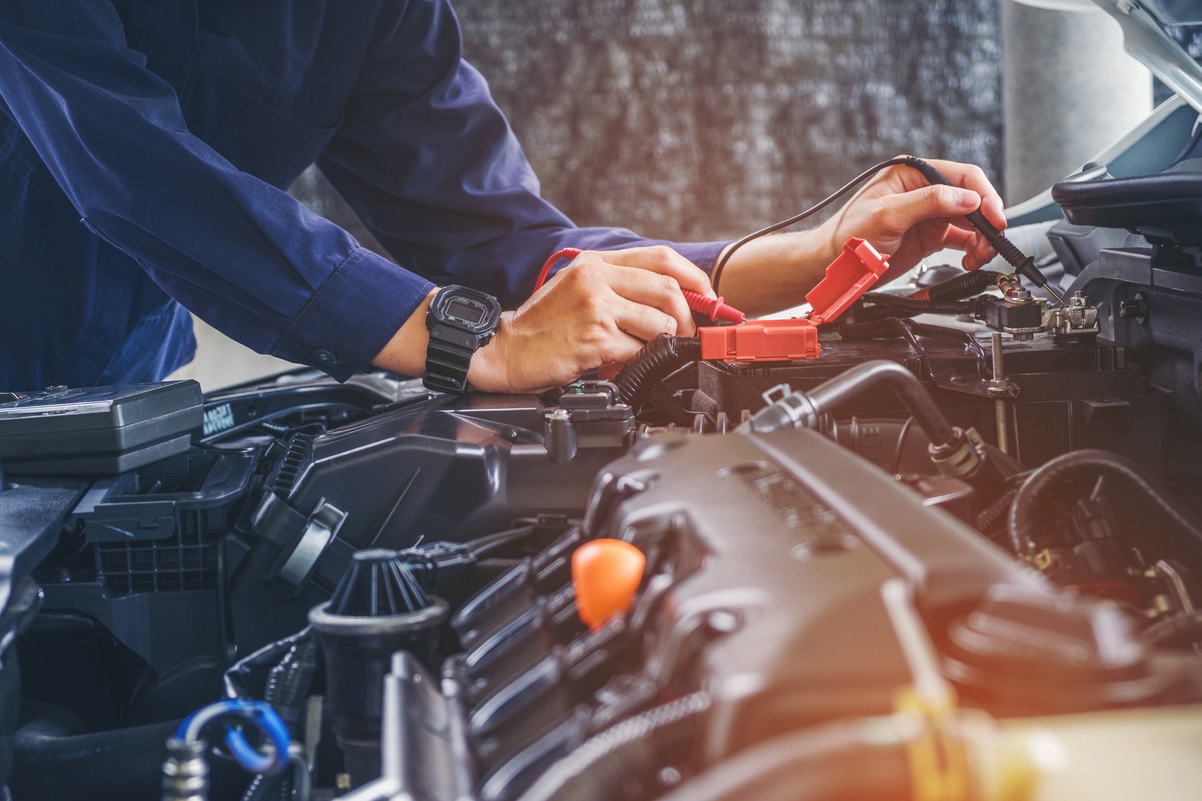 Hands of car mechanic  working in auto repair service.